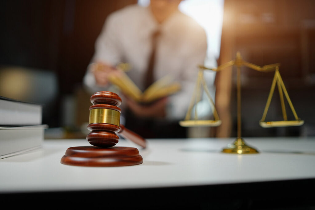 lawyer is standing and reading something 